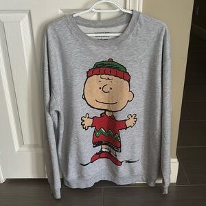 This is a christmas Charlie Brown crew neck in the size L